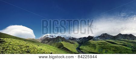 panorama of snowy mountain at sunrise