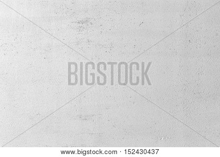 Grungy white concrete wall background. Background from high detailed fragment stone wall. Cement texture. Grey concrete wall.