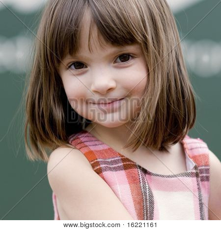 Portrait of a little girl with big brown eyes