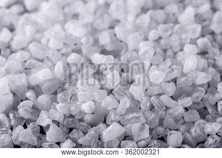 Coarse Sea Salt On A Dark Stone Background