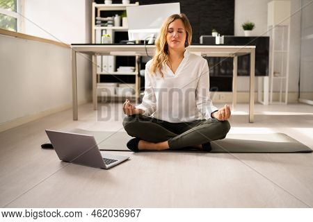 Employee Doing Mental Health Yoga Meditation In Office