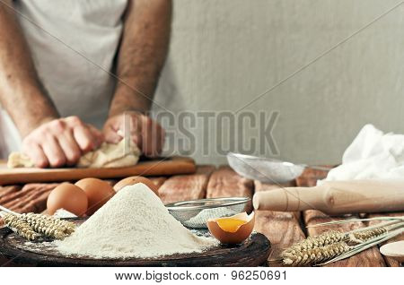 A Handful Of Flour With Egg On A Rustic Kitchen