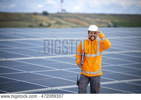 Portrait Of Solar Panel Worker Standing Inside Sustainable Energy Power Plant.