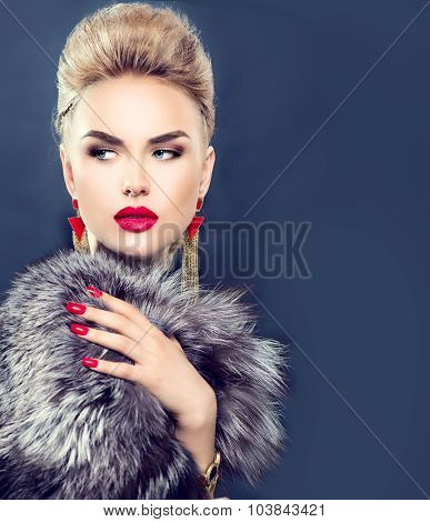 Winter Woman in Luxury Fur Coat. Beauty Fashion Model Girl in Blue Fox Fur Coat. Perfect Makeup and accessories. Beautiful Luxury Winter Lady