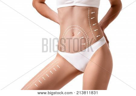 Female body with the drawing arrows on it isolated on white. Fat lose, liposuction and cellulite removal concept. Plastic surgery