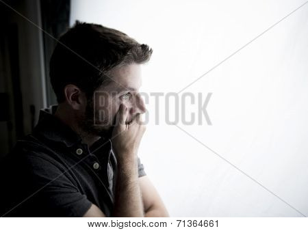 Attractive Man Leaning On Window Suffering Emotional Crisis And Depression