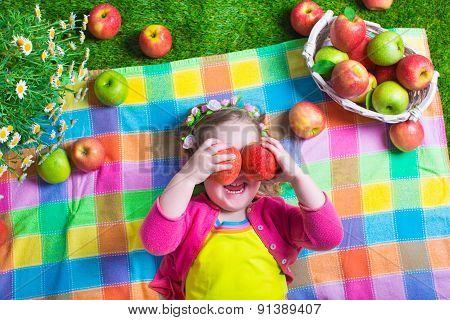 Little Girl Eating Apples