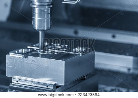 The CNC milling machine cutting the sample part.The chamfer tool cutting the mold part by CNC milling machine.