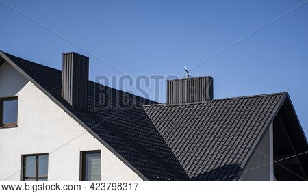 Grey Corrugated Metal Profile Roof Installed On A Modern House. The Roof Of Corrugated Sheet. Roofin