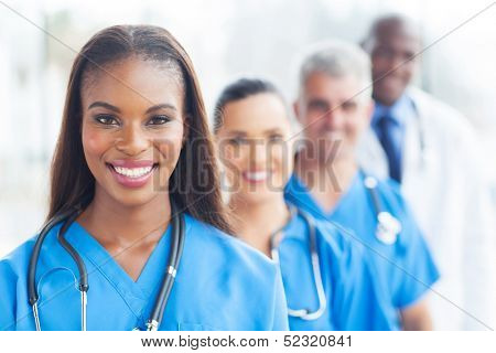 group of happy healthcare workers line up