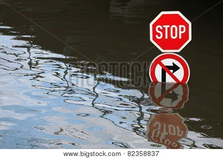 USTI NAD LABEM, CZECH REPUBLIC - JUNE 5, 2013: Stop and No right turn, traffic signs flooded by the swollen Elbe River in Usti nad Labem, Northern Bohemia, Czech Republic, on June 5, 2013.