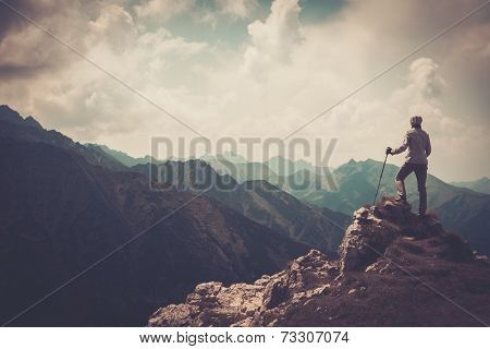 Woman hiker on a top of a mountain 