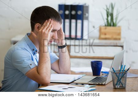 Young Office Man Suffering From Headache