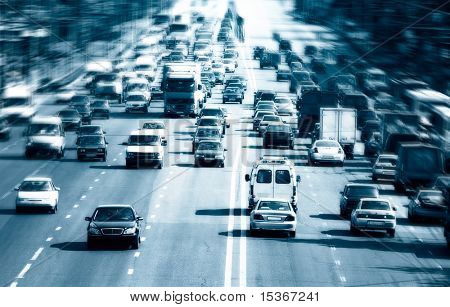 Highway with lots of cars. Blue tint, high contrast and motion blur to rise speed.