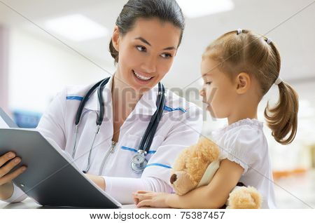 doctor examining a child in a hospital