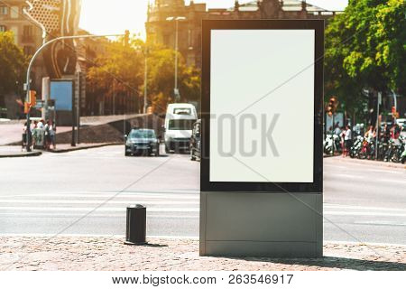 Outdoor Empty Informational Board Placeholder With A Busy Road Behind; White Blank City Billboard Mo