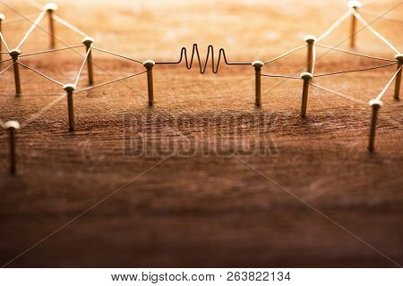 Communication. Two entities or network being connected with gold wire with wave form or in middle. Communication, Networking, social media, internet communication abstract. Rustic wood background.