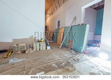 Working Process Of Installing Plasterboard Or Drywall For Making Gypsum Walls In Apartment Is Under 