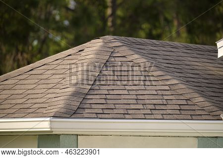 Closeup Of House Roof Top Covered With Asphalt Or Bitumen Shingles. Waterproofing Of New Building.