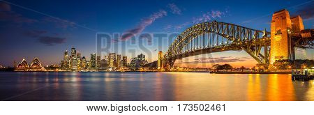 Sydney. Panoramic image of Sydney, Australia with Harbour Bridge during twilight blue hour.