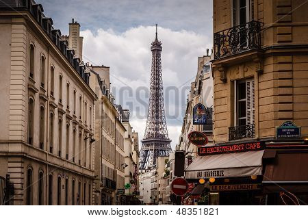 Parisian Street Against Eiffel Tower In Paris, France