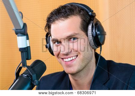 Presenter or host in radio station hosting show for radio live in Studio