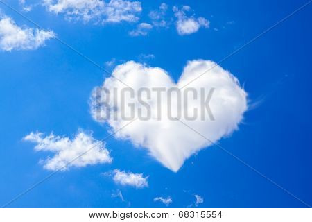 Blue Sky With A White Cloud In The Form Of Heart