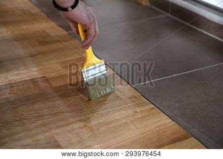 Varnishing Lacquering Parquet Floor By Paintbrush - Second Layer. Home Renovation Parquet. Varnish P