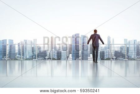 Businessman looking at city