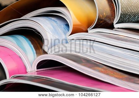 Close-up Of Stack Of Colorful Magazines