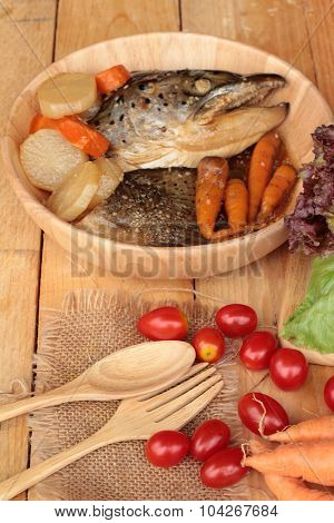 Salmon Head Cooked Of Tari Yaki Sauce With Fresh Vegetables.