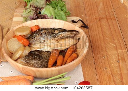 Salmon Head Cooked Of Tari Yaki Sauce With Fresh Vegetables.