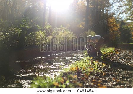 Young Children Exploring Nature On Wooded Path