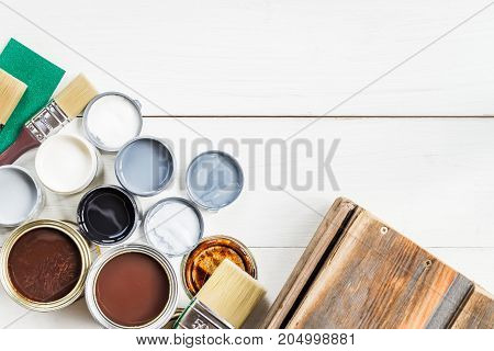 Open Cans Of Different Paints, Varnish And Stain