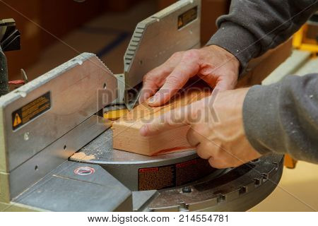 A carpenter works on woodworking Carpenter working on woodworking Man collects furniture boxes.