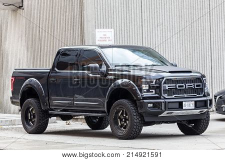 Toronto Canada - Oct 14 2017: Black Ford F 150 SVT Raptor Dakar Edition on a parking lot in the city of Toronto