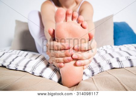 Woman's Leg Hurts, Pain In The Foot, Massage Of Female Feet