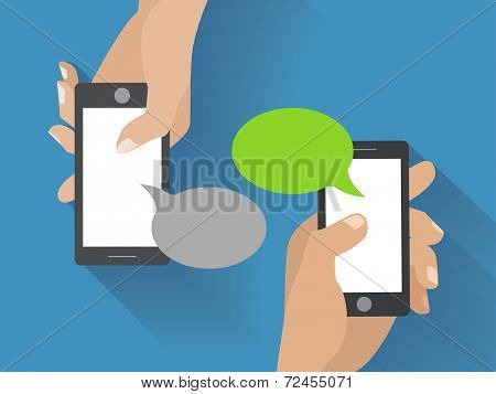 Hand holding black smartphone with blank speech bubbles for text