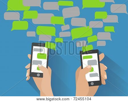 Hand holding black smartphone with blank speech bubbles for text