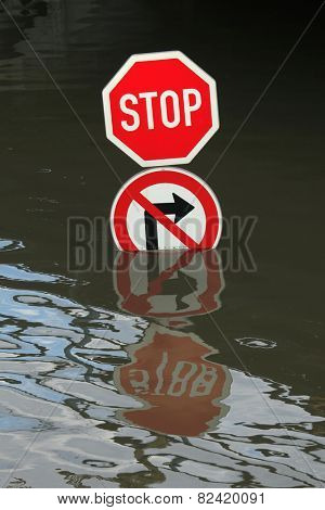 USTI NAD LABEM, CZECH REPUBLIC - JUNE 5, 2013: Stop and No right turn, traffic signs flooded by the swollen Elbe River in Usti nad Labem, Northern Bohemia, Czech Republic, on June 5, 2013.