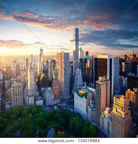 New York City Central Park at sunrise. New York background. New York City sunrise. New York Manhattan. New York colorful view. City of New York at cloudy sunrise.