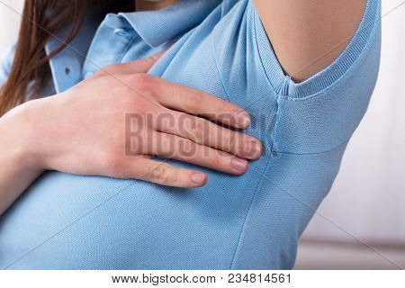 Close-up Of A Woman With Hyperhidrosis Sweating Very Badly Under Armpit