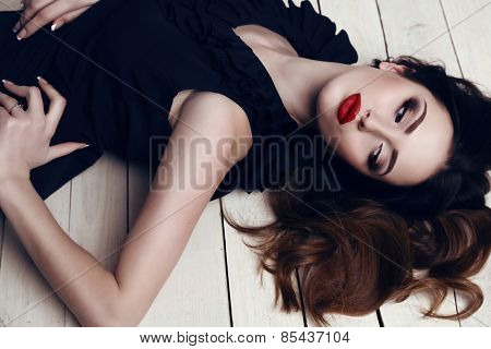 Beautiful Woman With Dark Hair And Bright Makeup