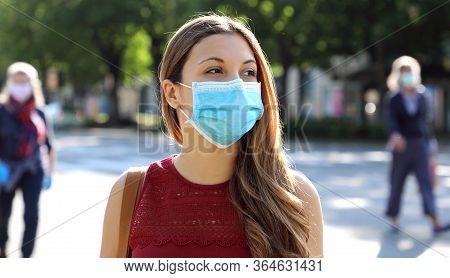 Covid-19 Social Distancing Woman In City Street Wearing Surgical Mask Against Disease Virus Sars-cov