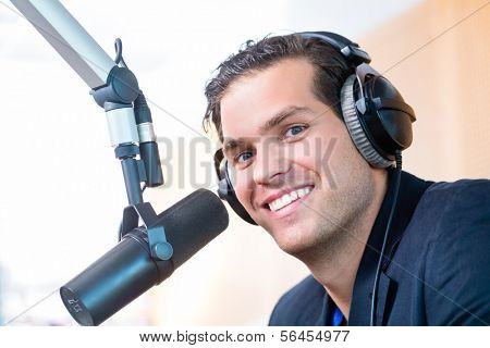 Presenter or host in radio station hosting show for radio live in Studio