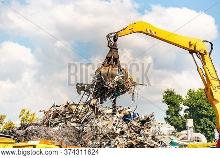 Close-up Of A Crane For Recycling Metallic Waste On Scrapyard