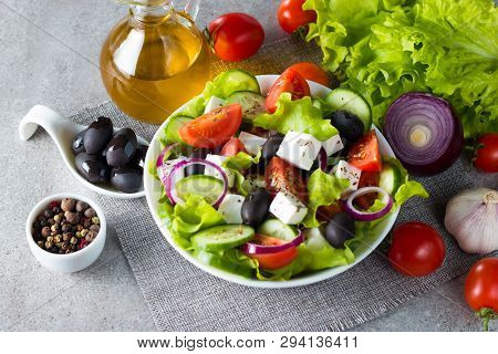 Fresh Greek Salad Made Of Cherry Tomato, Ruccola, Arugula, Feta, Olives, Cucumbers, Onion And Spices