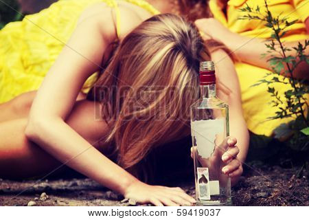 Teen alcohol addiction (drunk teens with vodka bottle) 