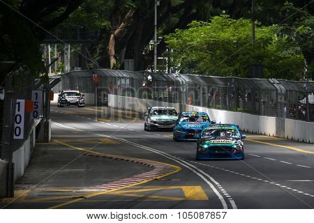 KUALA LUMPUR, MALAYSIA - AUGUST 08, 2015: Turbo charged V8 supercars take part in the V8 Supercars Street Challenge at the 2015 Kuala Lumpur City Grand Prix.