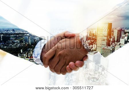 Partnership. Double Exposure Image Of Investor Business Man Handshake With Partner For Successful Me